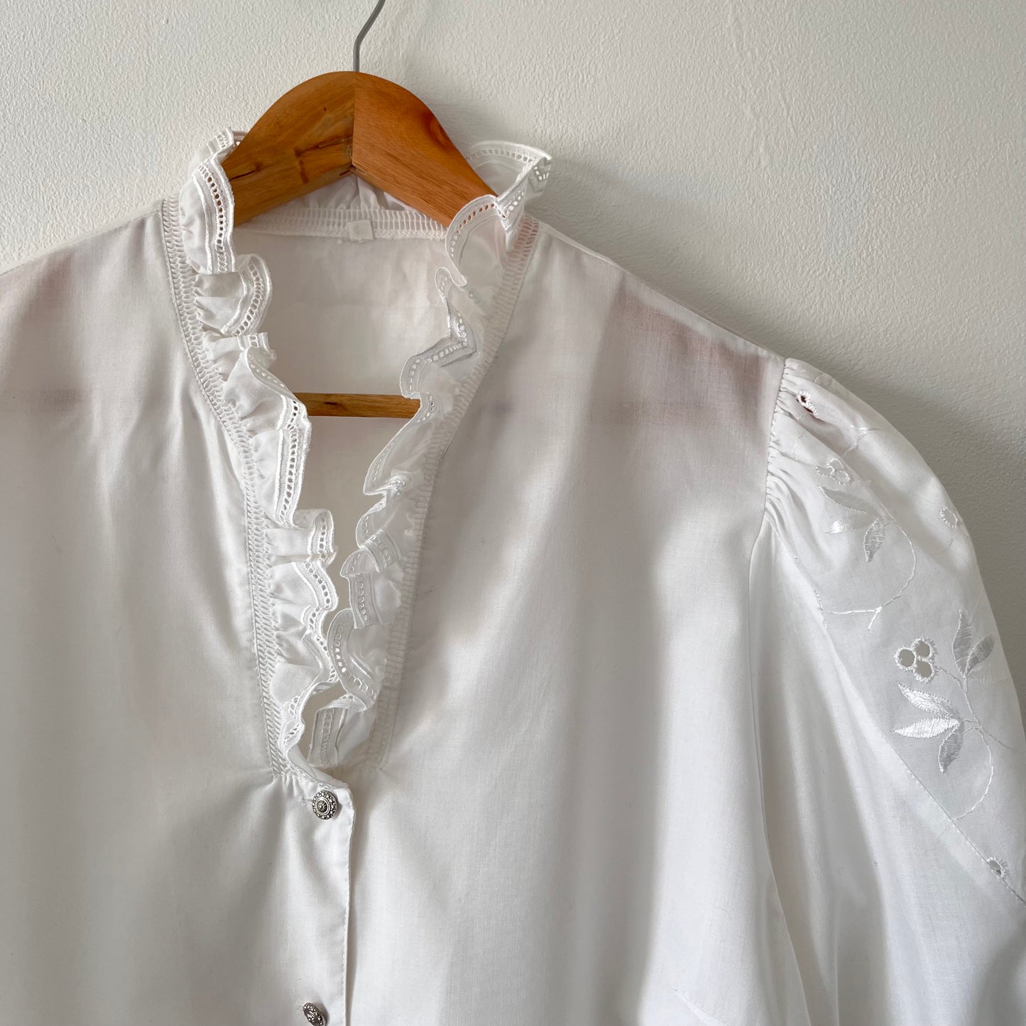 White vintage blouse with puffed sleeves and embroidery