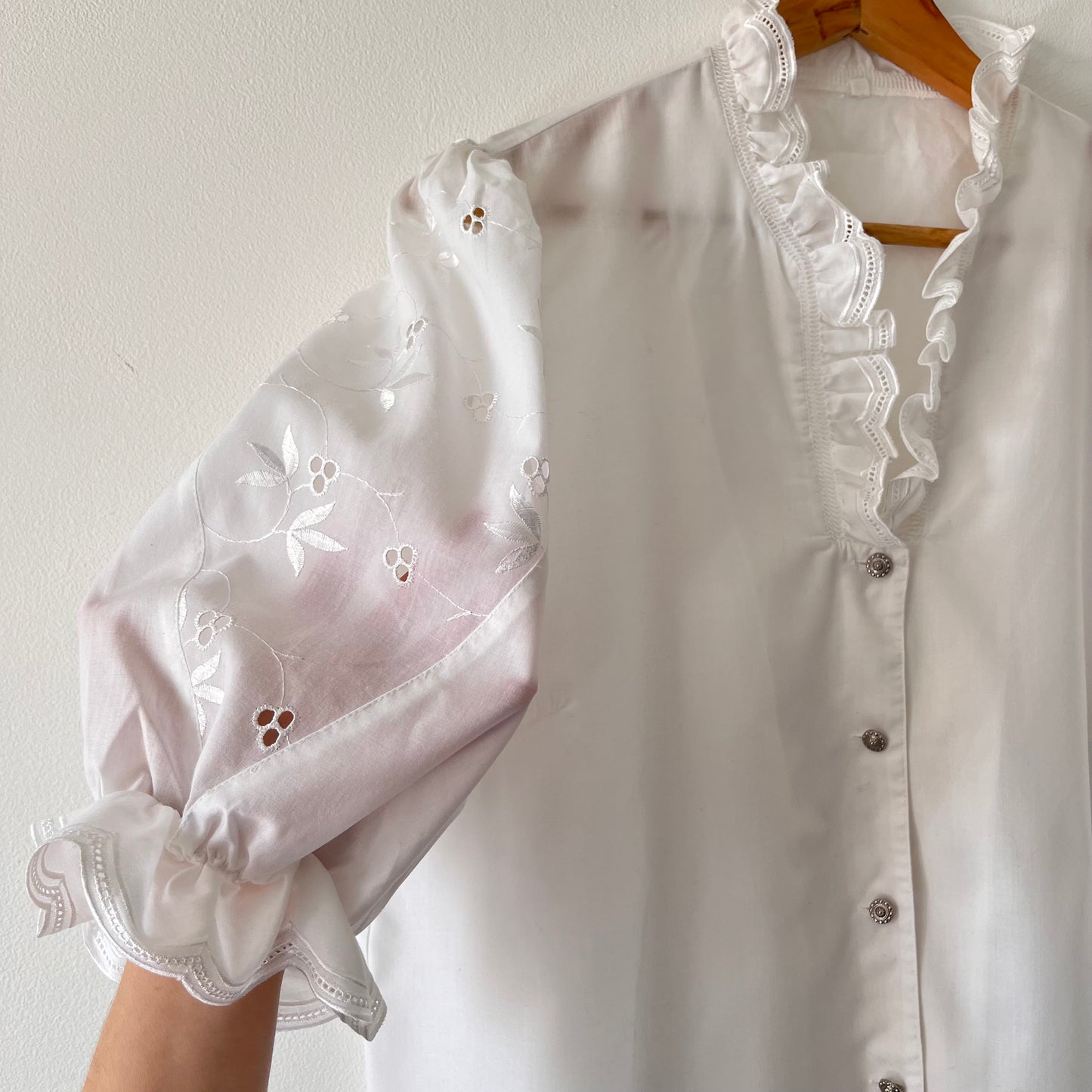 White vintage blouse with puffed sleeves and embroidery