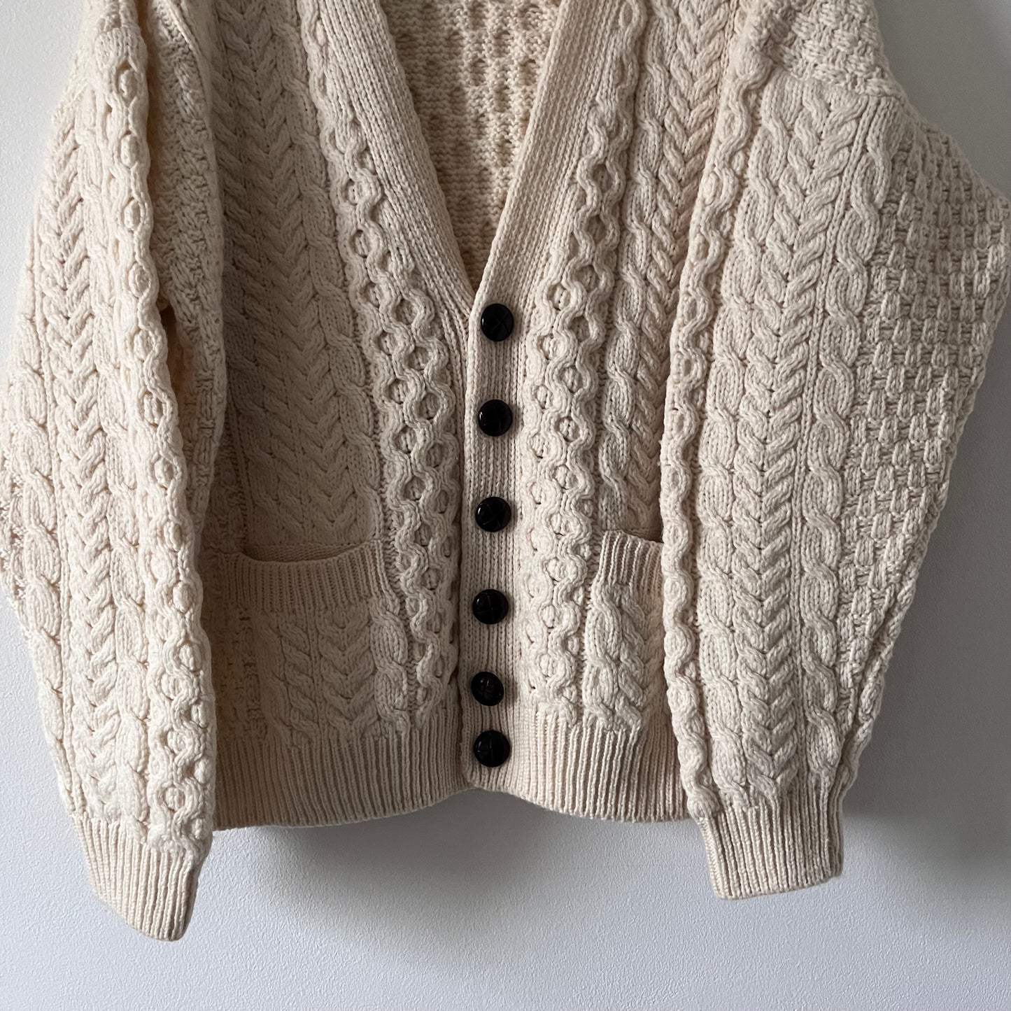 Cable knit merino wool cream cardigan