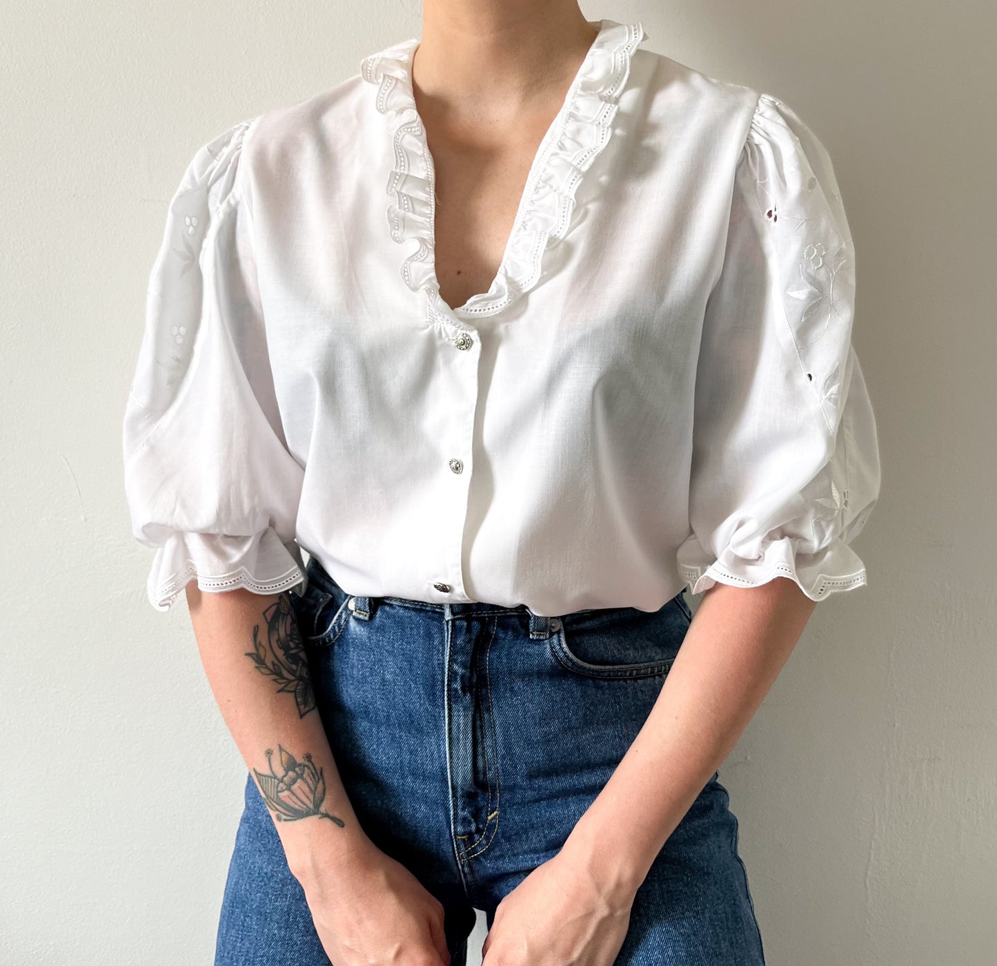 White vintage blouse with puffed sleeves and embroidery