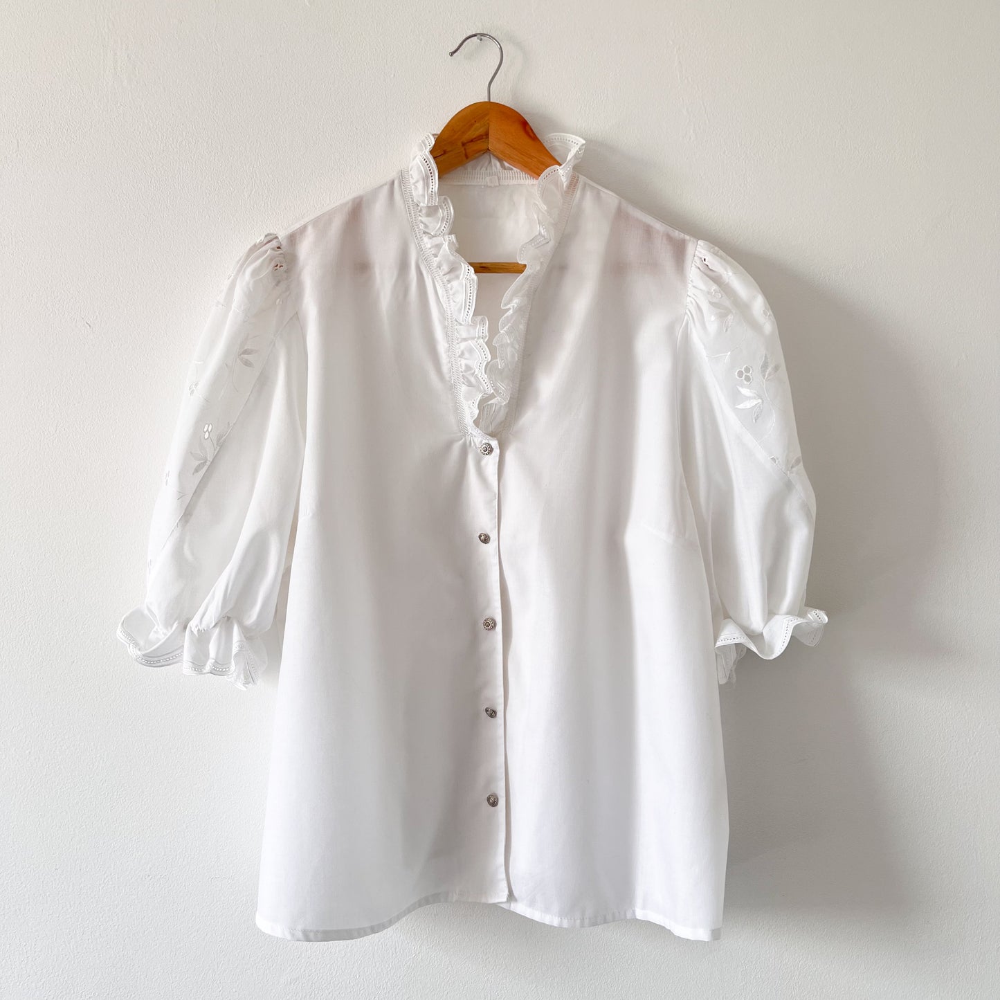 White vintage blouse with puffed sleeves and embroidery